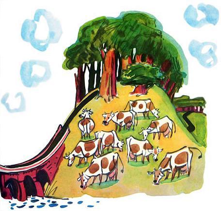стадо коров пасется на лужайке